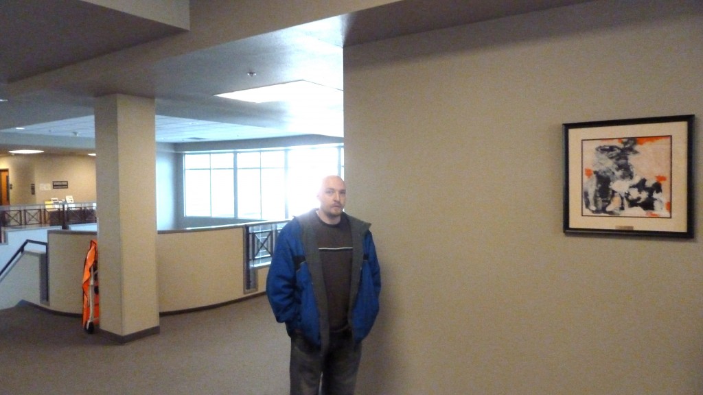 Oliver Doss waits for Christina in Courthouse Hallway after hearing
