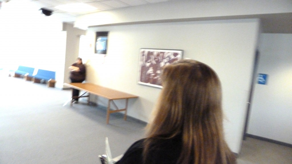 Sara Dotson walks to call court security, complains her image could be 'photo shopped' in her anti-harassment petition